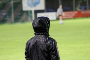 football manager in the rain